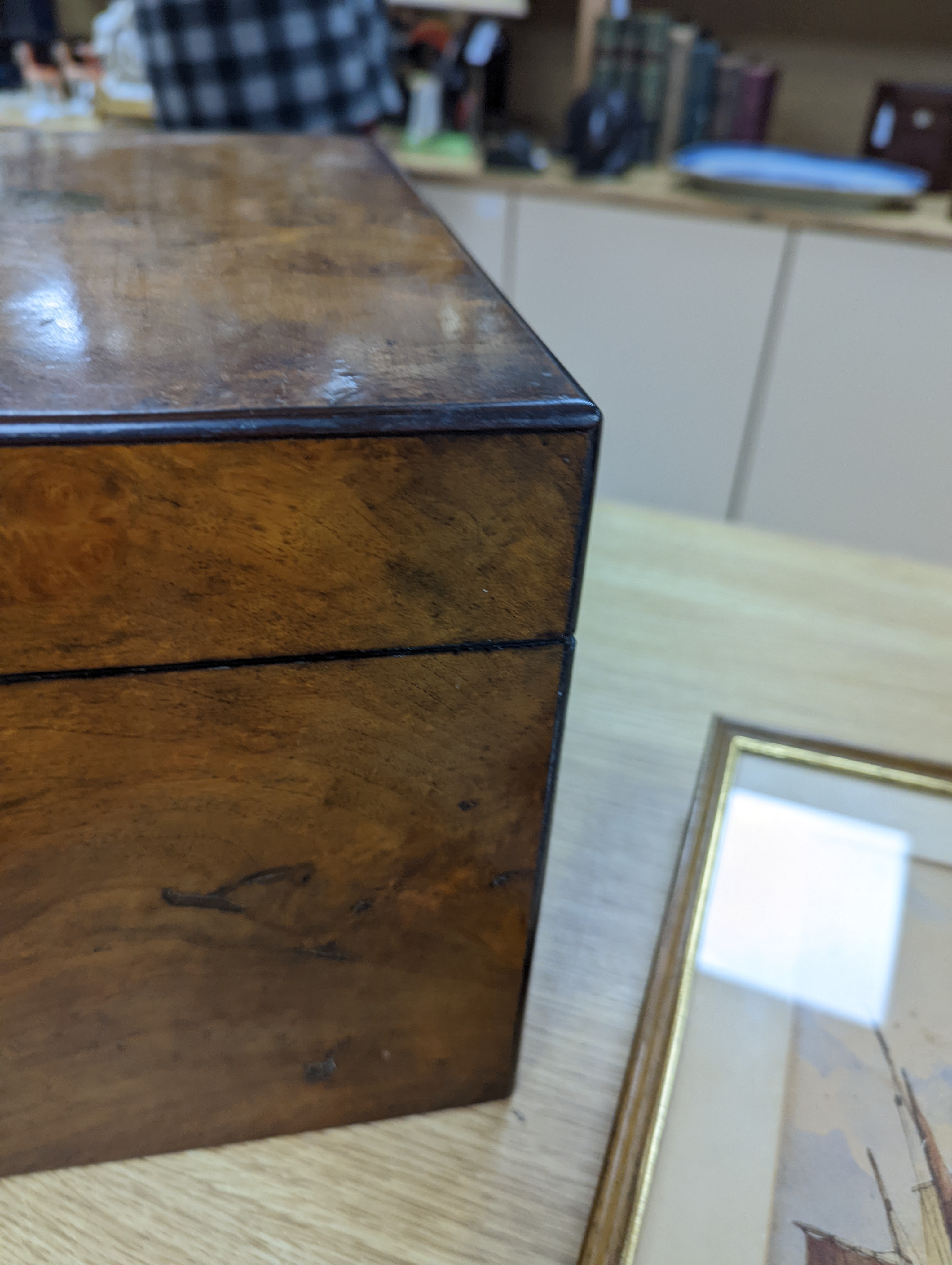 A Victorian walnut sewing casket, 34cm, containing sewing related accessories